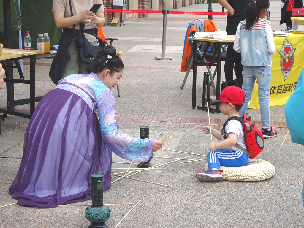 Student helping a little boy 