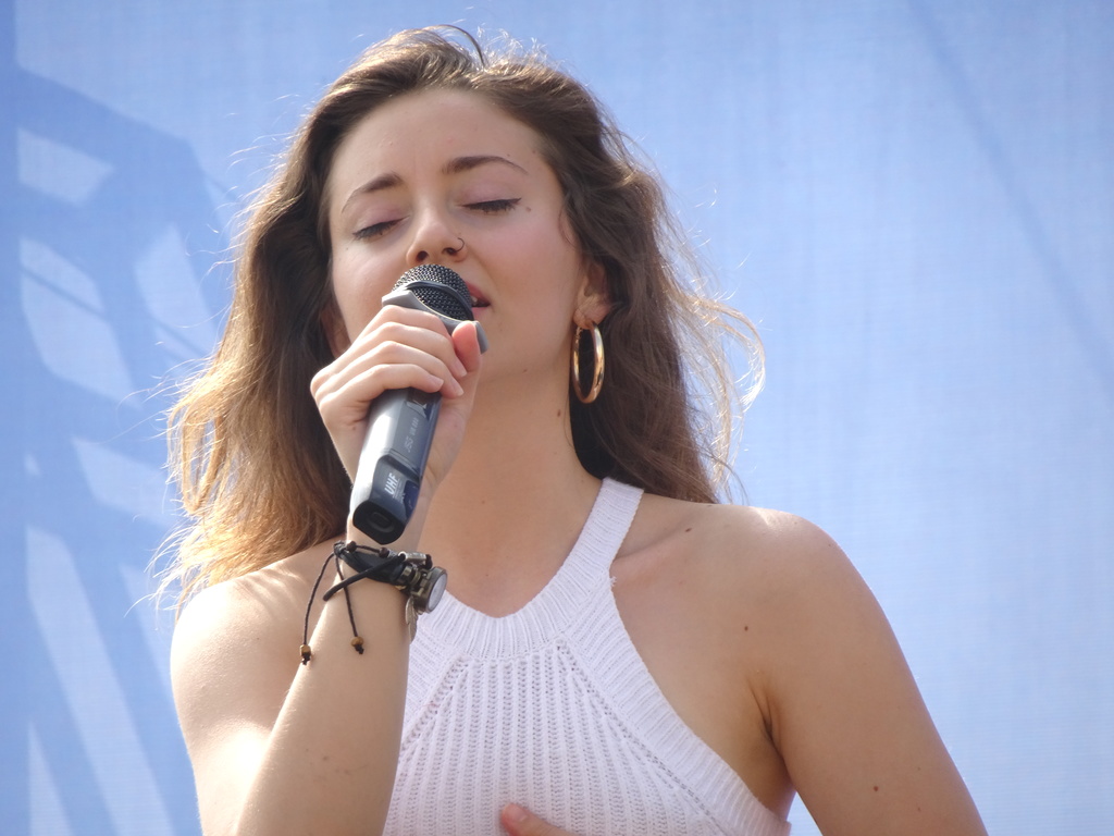 Student singing on stage